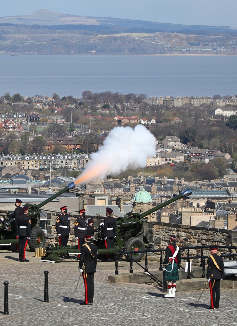 Image: Members of the 105th Regiment Royal Artillery fire a 41-round gun salute at Edinburgh Castle in Scotland