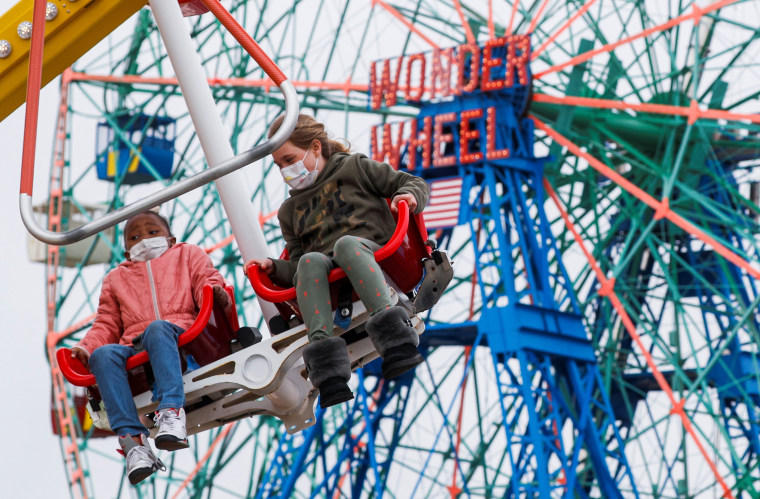 Image: Guests enjoy a ride at Luna Park on the first day of the Coney Island parks reopening in the Coney Island neighborhood of Brooklyn, New York