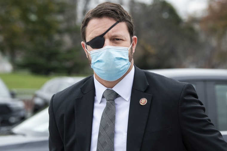Dan Crenshaw, R-Texas, is seen at the House steps of the Capitol during votes on Friday, December 4, 2020.