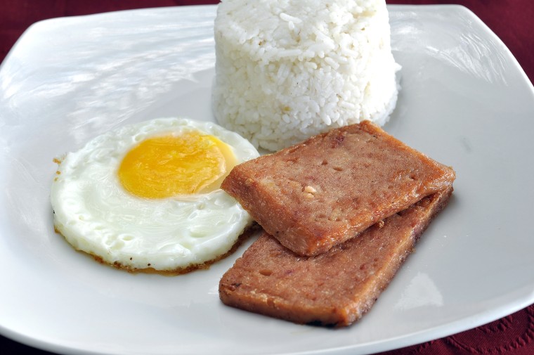 A traditional Hawaii breakfast of fried Spam, a fried egg and rice.