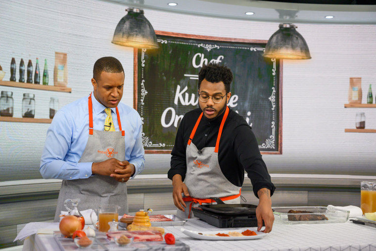craig melvin and onwuachi stand on the set of the TODAY Show with food in front of them, cooking.
