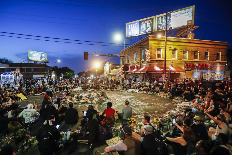 Image: Protesters at a June memorial for George Floyd in Minneapolis