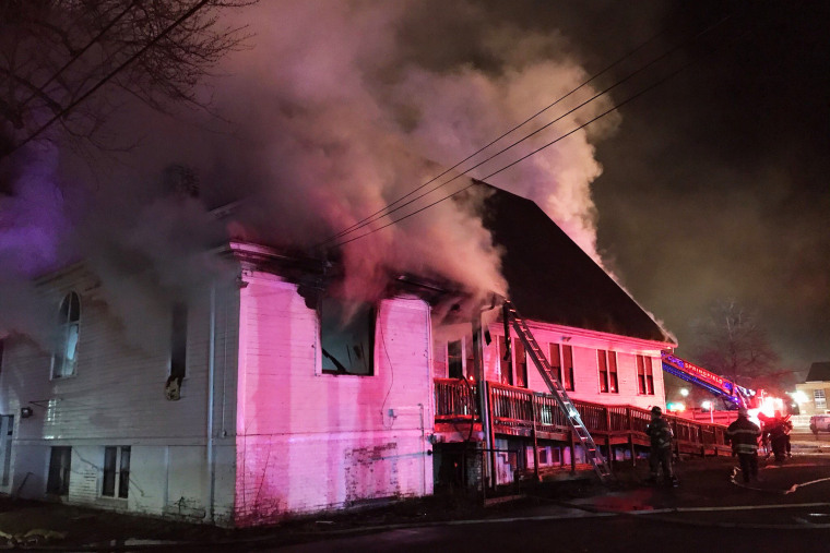 Firefighters work to put out a fire at Martin Luther King Jr. Community Presbyterian Church in Springfield, Mass., on Dec. 28, 2020.