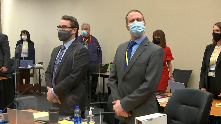 Defense attorney Eric Nelson, left, and former Minneapolis police Officer Derek Chauvin, right, at the Hennepin County Courthouse in Minneapolis on Tuesday.