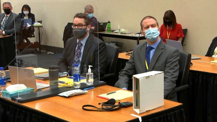 IMAGE: Defense attorney Eric Nelson and Derek Chauvin in court