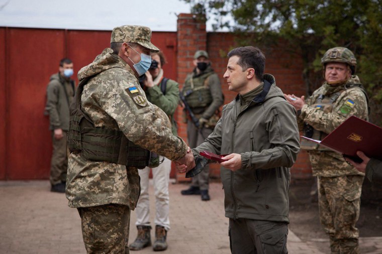 Image: Zelensky shakes hands with a serviceman in the Ukrainian town of Zolote last week