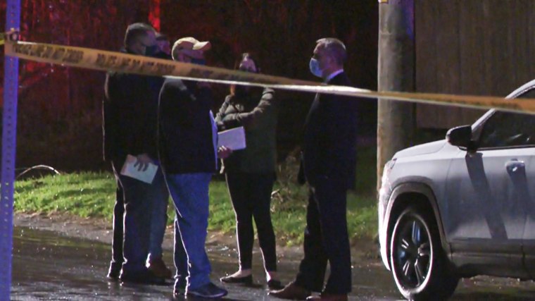 Law enforcement officials respond to the scene of a shooting in Syracuse, N.Y., on April 11, 2021.