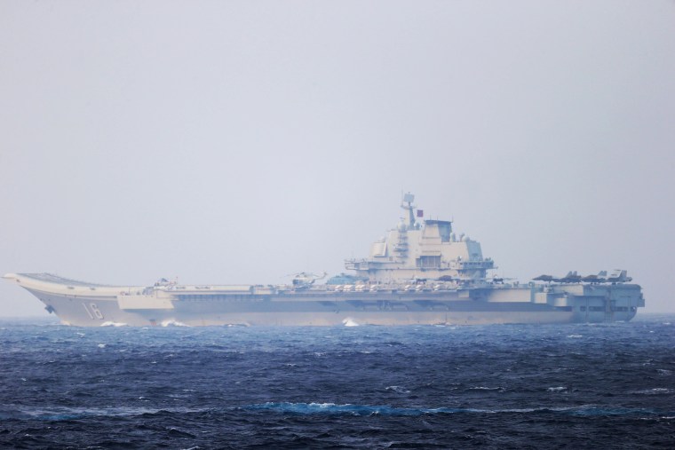 Image: Chinese aircraft carrier Liaoning sails through the Miyako Strait near Okinawa on their way to the Pacific in this handout photo