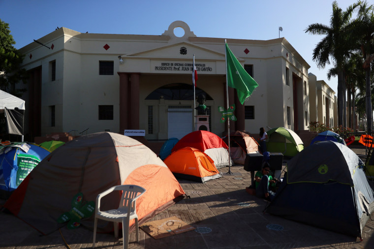 Tents of abortion rights activists are set up in front of the National Palace during a protest to pressure parliament to end the total ban on abortion in Santo Domingo, Dominican Republic, on March 18, 2021.