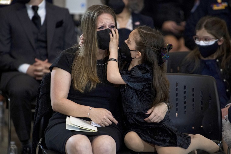 Image: Abigail Evans, 7, the daughter of late U.S. Capitol Police Officer William Evans, and her mother Shannon Terranova, pay their respects as his remains lie in honor in the Capitol rotunda on April 13, 2021.