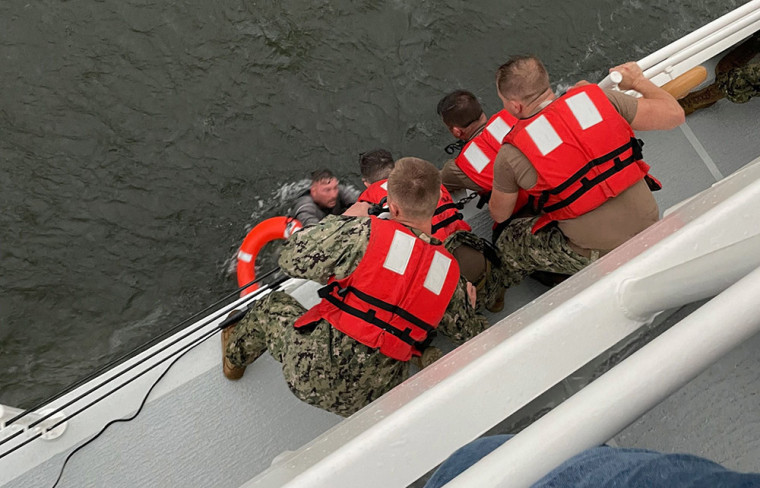 Image: The crew of the Coast Guard Cutter Glenn Harris pull a person from the water