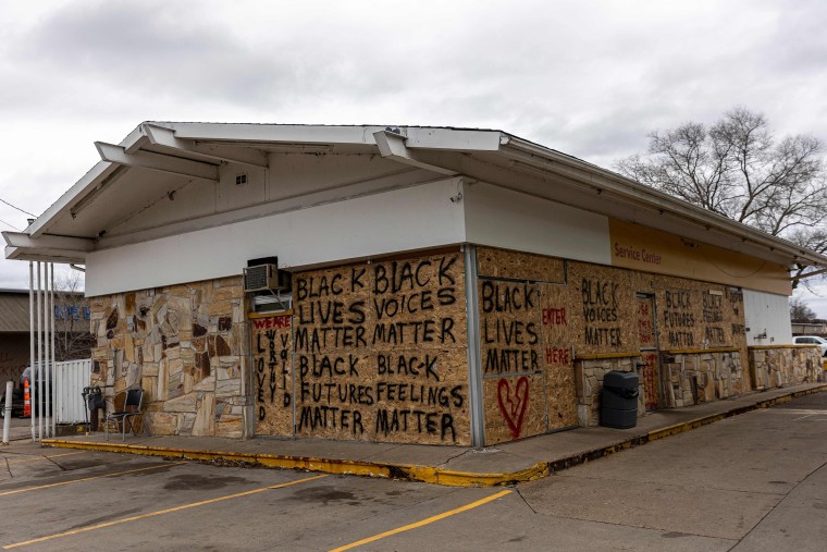 Image: A gas station is boarded