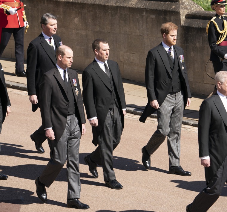 Image: Prince William, Peter Phillips, Prince Harry, and Vice-Admiral Sir Timothy Laurence follow Prince Philip's coffin as it arrives at St. George's Chapel.