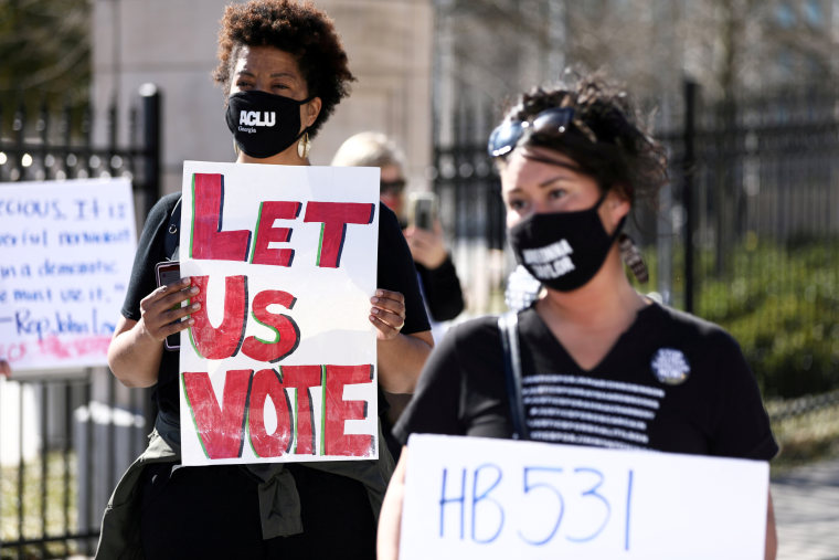 Protesters gather to protest HB 531, which would place tougher restrictions on voting in Georgia, in Atlanta on March 4, 2021.