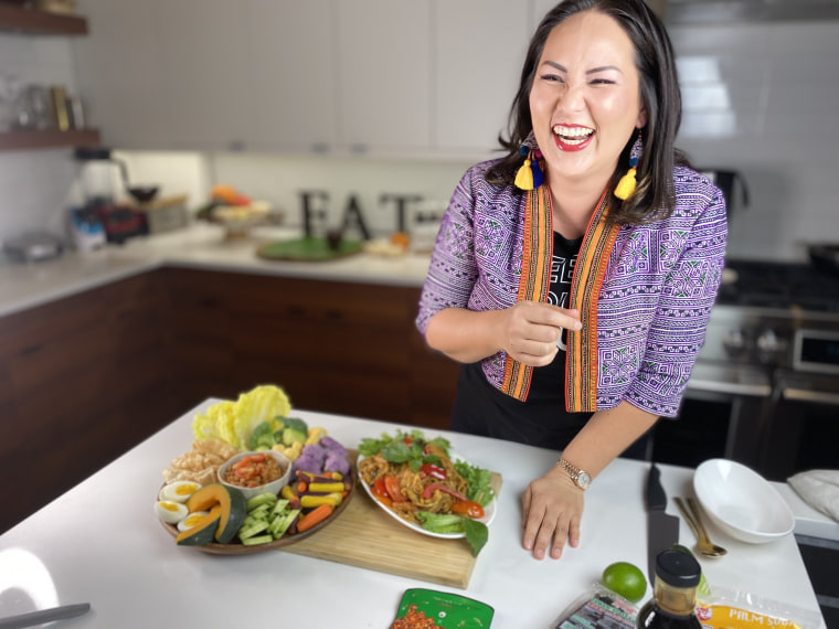In her own kitchen, Nikky Phinyawatana, the creator and owner of Dallas' highly acclaimed, award-winning Asian Mint Restaurants, shows off completed dishes from her at-home Zoom cooking experience through her brand Nikky Feeding Souls.