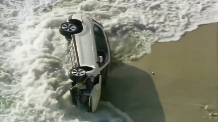 Authorities said the SUV smashed through a guardrail in Carlsbad, California. 