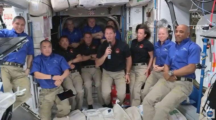 This screen grab taken from the NASA live feed shows ESA (European Space Agency) astronaut Thomas Pesquet (fourth right) speaking during a welcoming ceremony with crew members of the International Space Station and crew members of the SpaceX's Crew Dragon spacecraft, on April 24.