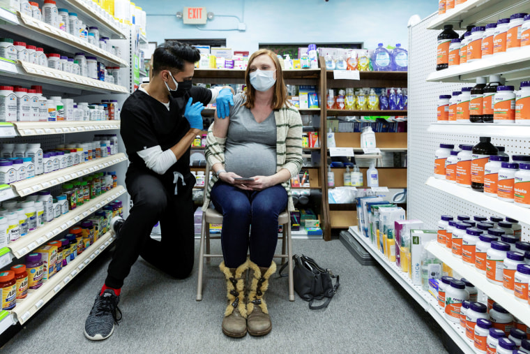 A pregnant woman receives the Pfizer-BioNTech vaccine in Schwenksville, Pa., on Feb. 11, 2021.