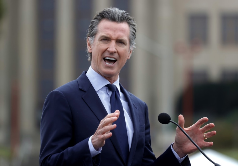 Image: California Gov. Gavin Newsom speaks during a news conference after touring the vaccination clinic at City College of San Francisco