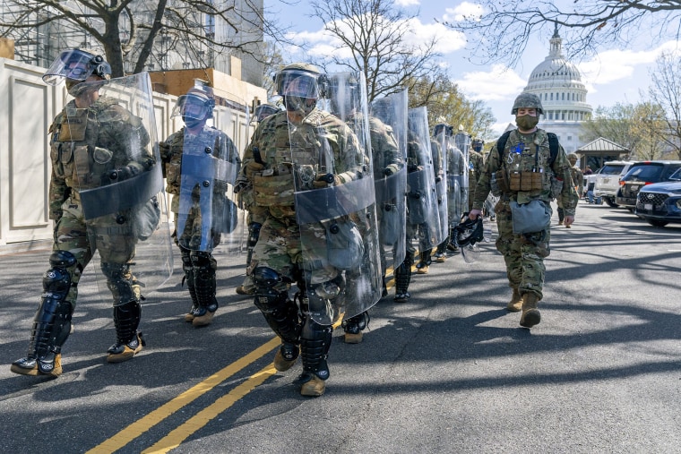 Image: Members of the National Guard leave the Capitol perimeter they had been guarding on April 2, 2021, after a car crashed into a barrier on Capitol Hill.