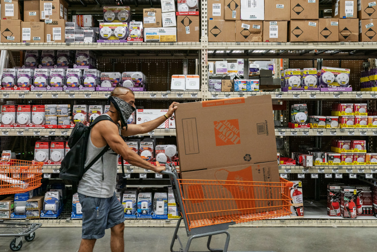 Image: A shopper pushes a cart at a Home Depot Inc. store in Jersey City, New Jersey, on Aug. 14, 2020.