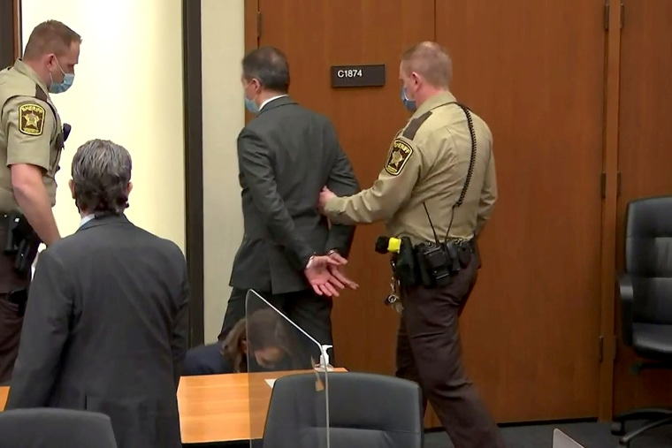 Image: Former Minneapolis police Officer Derek Chauvin is led away in handcuffs