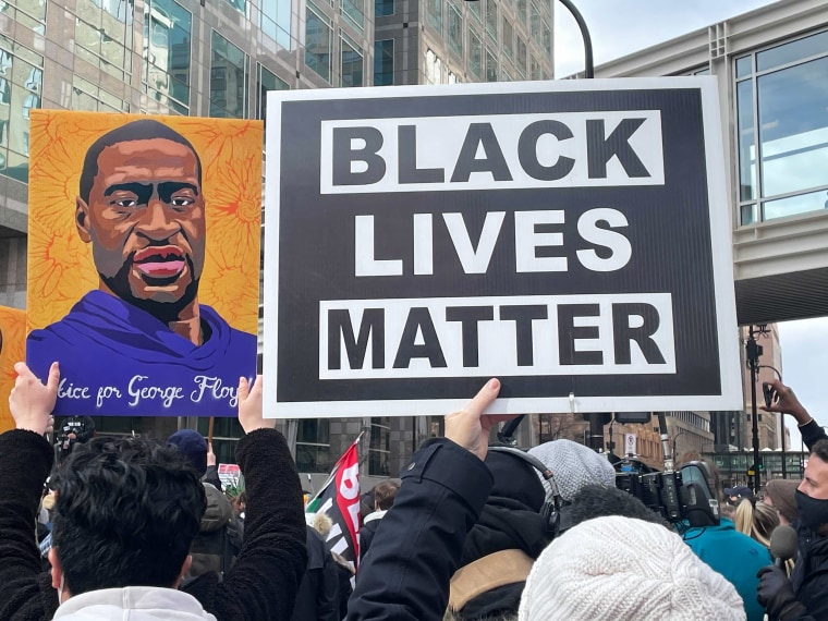 Image: People gather outside the Hennepin County Government Center in Minneapolis