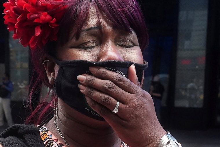 Image: A woman reacts after the verdict in the trial of former Minneapolis police officer Derek Chauvin in New York