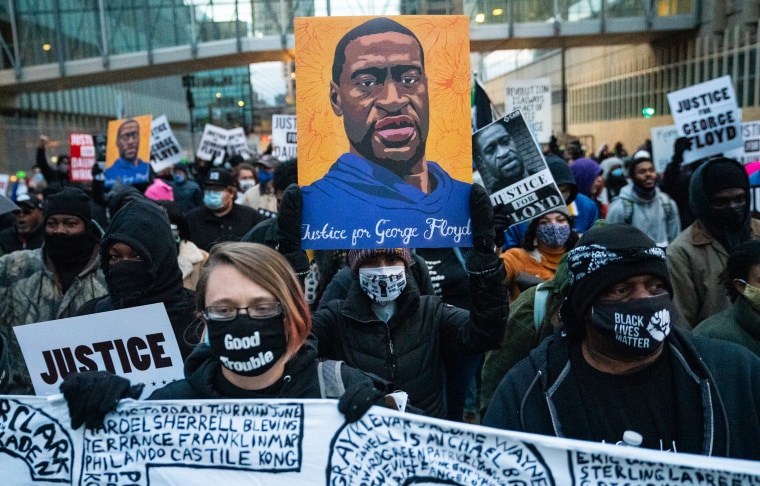 Image: Protesters march around downtown Minneapolis near the courthouse calling for justice for George Flyod after closing arguments in the Chauvin trial has ended