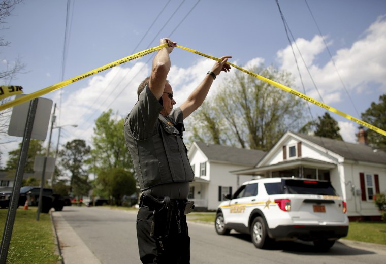 Law enforcement investigate the scene of a shooting on April 21, 2021 in Elizabeth City, N.C.