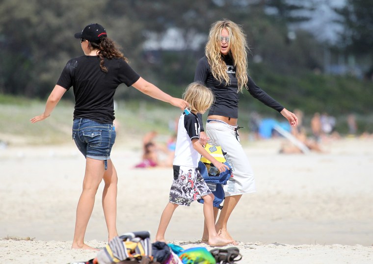 Image: Elle Macpherson enjoyed time with her sons in the beach in Byron Bay, Australia.