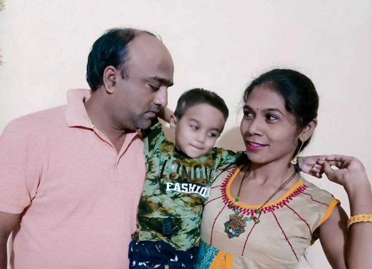 Image: Praveen Dupare with his five-year-old son and wife, Khushbu.