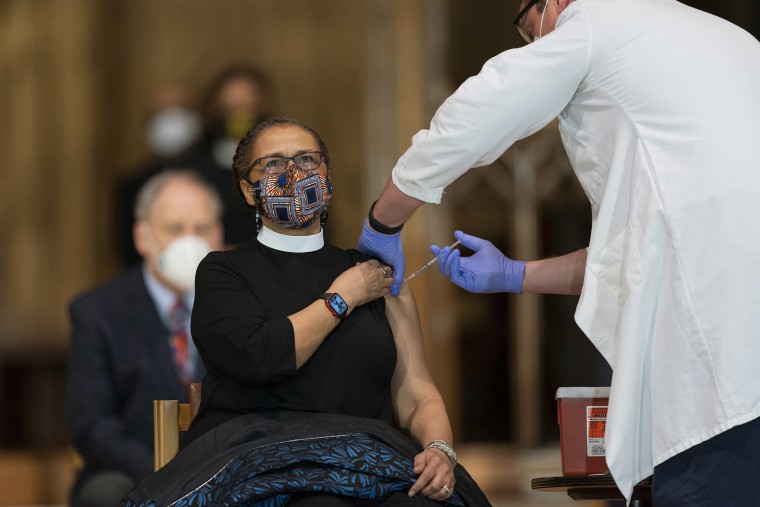 Image: Rev. Patricia Hailes Fears, pastor of the Fellowship Baptist Church in Washington, is administered with the Johnson &amp; Johnson Covid-19 vaccine at the Washington National Cathedral