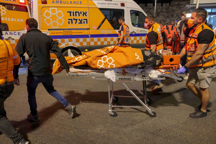 Image: An injured Palestinian protester is transported into an ambulance after being hit during clashes outside the Damascus Gate in Jerusalem's Old City