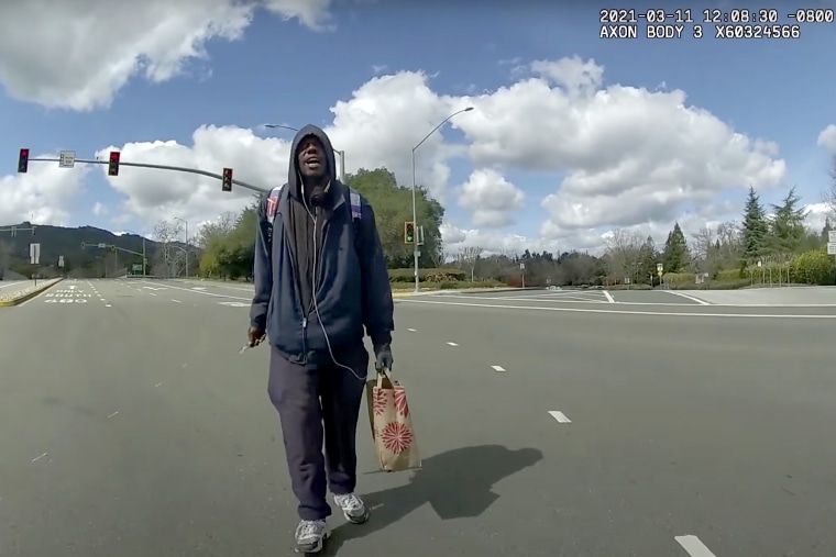 Image: A still from body-worn camera video shows Tyrell Wilson, holding a knife in his right hand, approaching Deputy Andrew Hall in the middle of an intersection on March 11, 2021, in Danville, Calif.