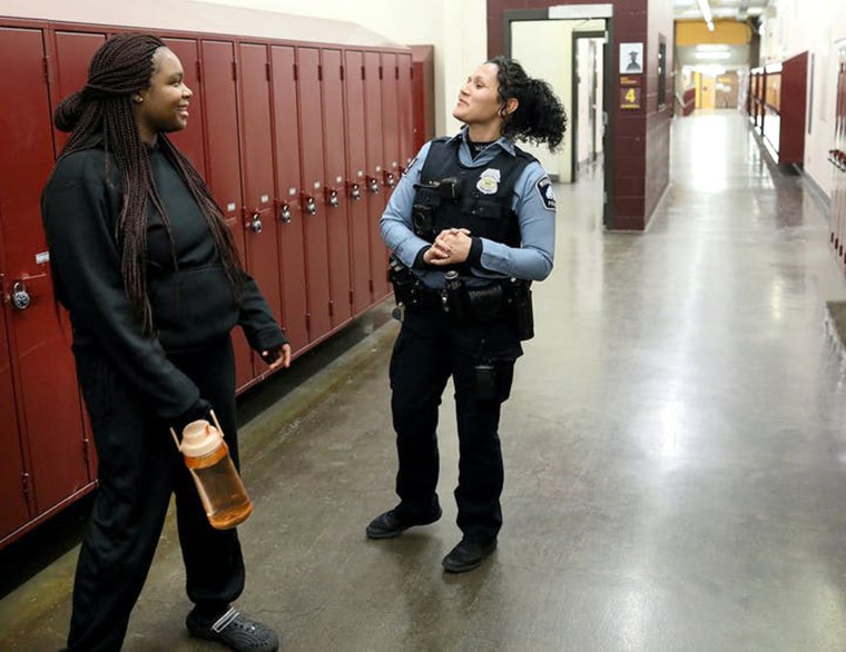 Darnella Frazier, left, chats with school resource officer Drea Leal at Minneapolis Roosevelt High School in January 2019.