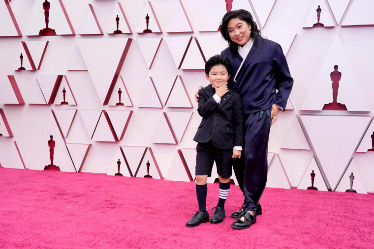 Image: Actor Alan S. Kim and Producer Christina Oh arrive at the Oscars on April 25, 2021, at Union Station in Los Angeles.