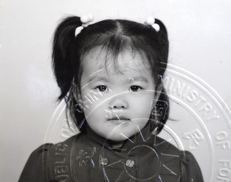 JiaYing Grygiel's passport photo at age 4, when she received her new American name, Caroline.