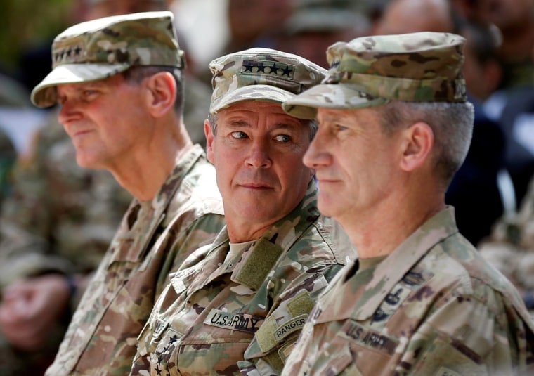 Image: U.S. Army General Scott Miller, center, looks on during a change of command ceremony in Resolute Support headquarters in Kabul