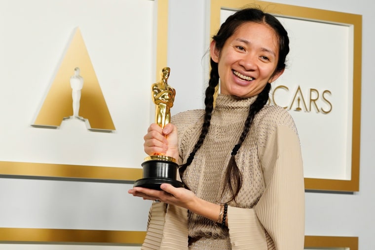 Image: Chloe Zhao, winner of the award for best picture for \"Nomadland,\" poses in the press room at the Oscars in Los Angeles
