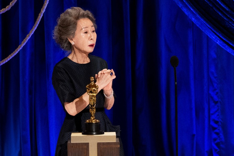Youn Yuh-jung accepts the Oscar for best actress in a supporting role for "Minari" during the 93rd Annual Academy Awards in Los Angeles.