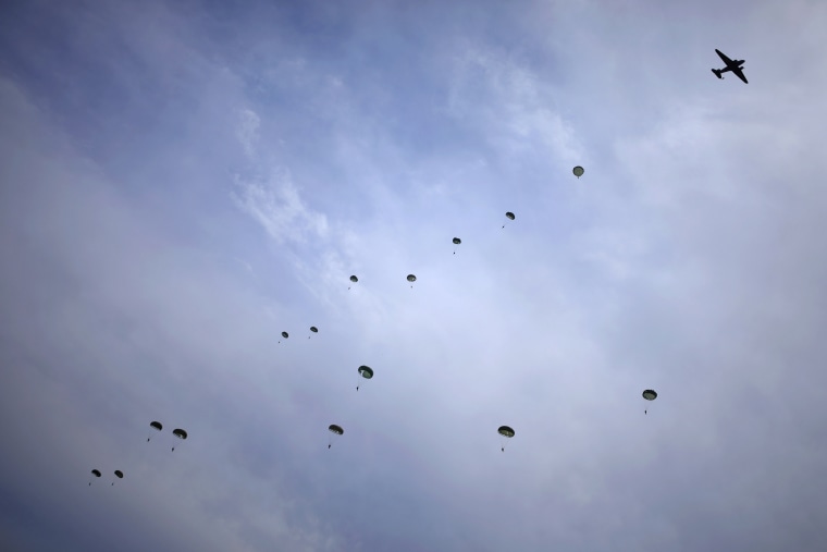 Static line parachutists jump from a C-47 Skytrain.