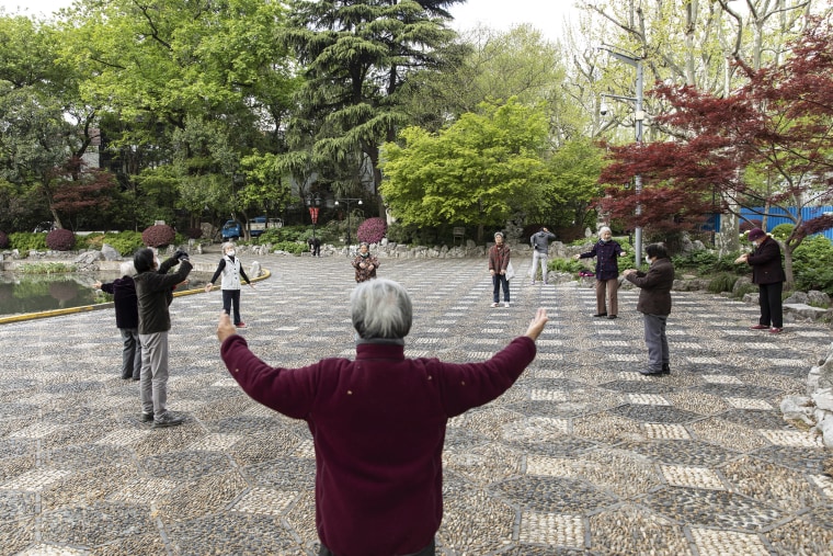 Image: People exercise in a park in Shanghai, China