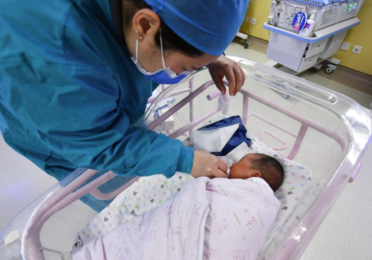 Image: A newborn baby being cared for in the ward of the hospital neonatal care center in Fuyang, China