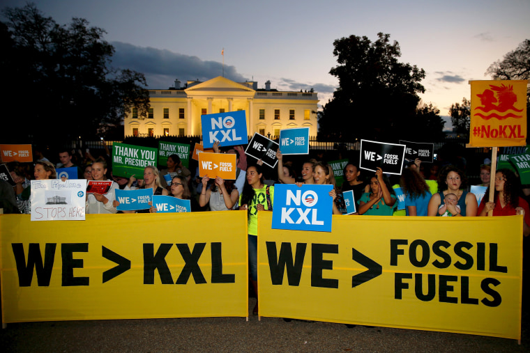 Activists gather outside the White House to celebrate the Obama administration's rejection of the Keystone XL pipeline on Nov. 6, 2015.