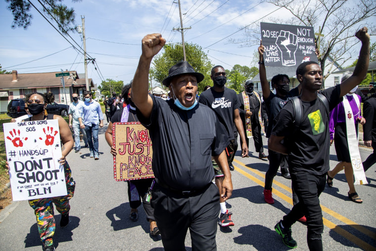 Image: Demonstrators, led by clergy, march on April 28, 2021 from Mt. Lebanon AME Zion Church in Elizabeth City to the site where Andrew Brown Jr. was shot and killed by Pasquotank County Sheriff deputies.