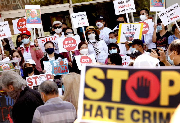 Members of the Thai-American community along with political leaders and members of law enforcement participate in a rally against Asian hate crimes in Thai Town in Los Angeles on April 8, 2021.