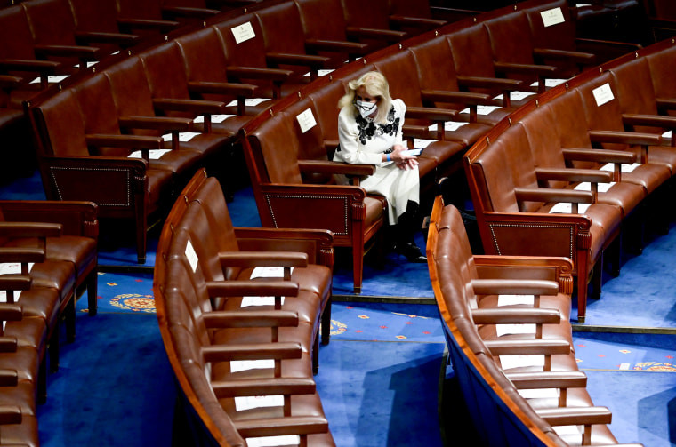 Image: Rep. Debbie Dingell, D-Mich., waits in her seat for President Joe Biden's joint address to Congress to begin at the Capitol on April 28, 2021.