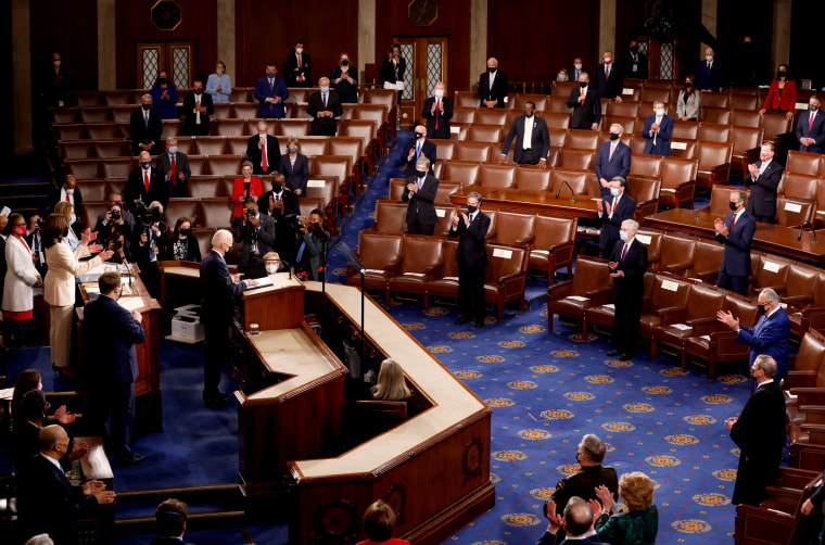 Image: President Joe Biden receives a standing ovation from a socially distanced Chamber before his joint address to Congress on April 28, 2021.