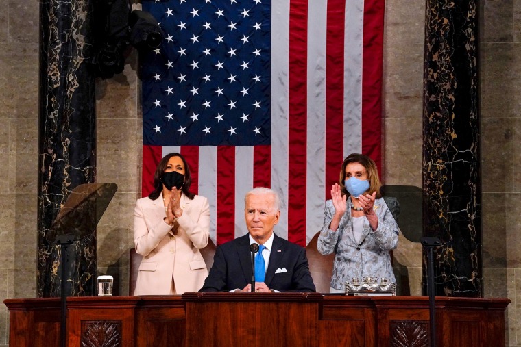 Image: Vice President Kamala Harris and Speaker of the House of Representatives Nancy Pelos applaud as President Joe Biden addresses a joint session of Congress at the U.S. Capitol on April 28, 2021.